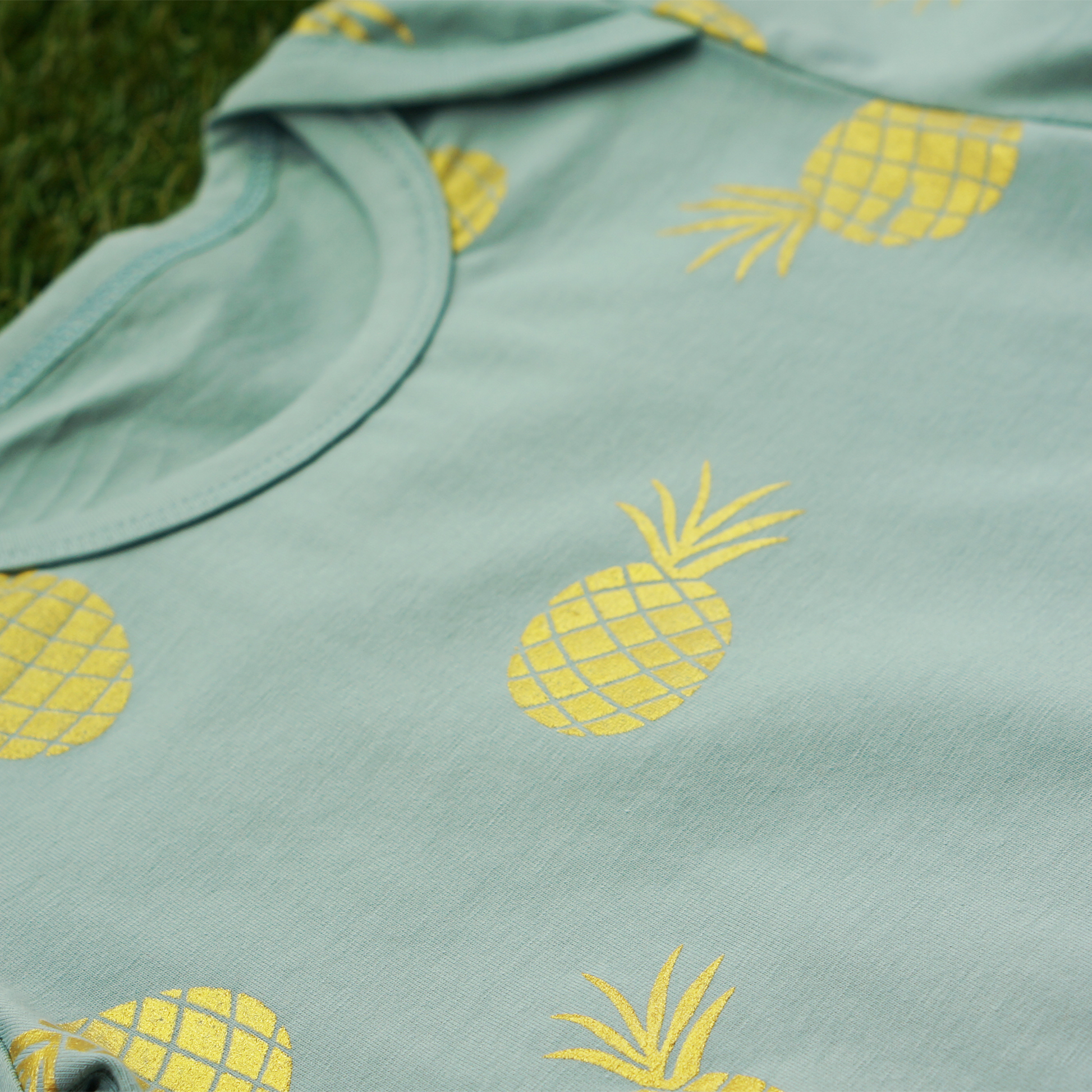 envelope neck baby toddler boy romper onesie in teal colour with golden pineapple print on cotton spandex anak and i sg anak & i sg
